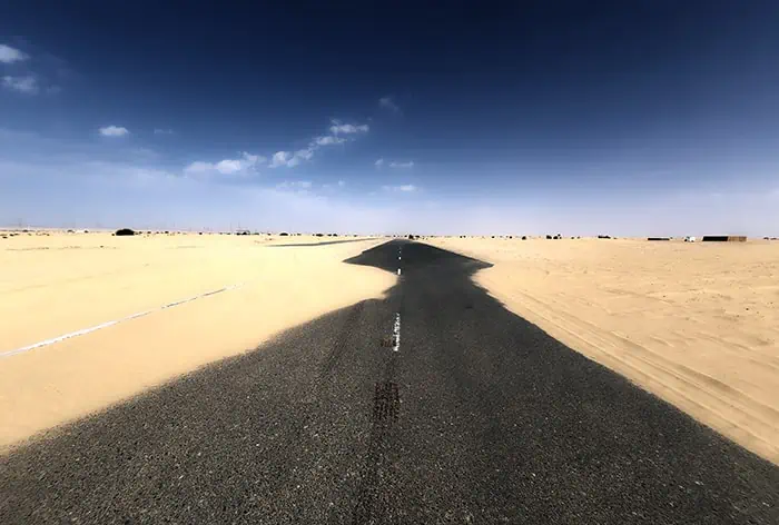  sand accumulation with or without road barrier